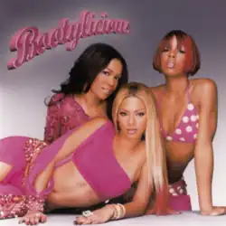 The group seated next to one another in matching pink outfits with a grey background and the title of the song in violet script
