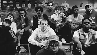Brockhampton pictured in 2019; clockwise from left: Dom McLennon, Matt Champion, Kevin Abstract, Romil Hemnani, Robert Ontenient, Bearface, Joba, Merlyn Wood, Kiko Merley, Jabari Manwa, HK (Henock Silehsi), Jon Nunes