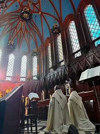 Two cantors chant the Litany of the Blessed Virgin Mary during the Saturday Compline station to Mary.