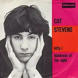 The Dutch picture sleeve for Cat Stevens' fifth single "Kitty", backed by the song "Blackness of the Night". It was released on Deram Records. The sleeve depicts Cat Stevens with his cheeks in his hands.