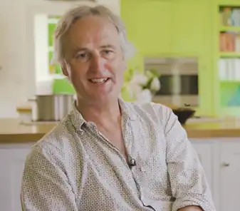 A screenshot of Charlie Bingham from his company's video in November 2022.