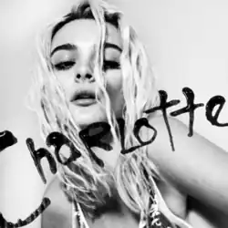 A black-and-white close-up of a young woman with blonde hair, with the name "Charlotte" written across her face in black paint or ink