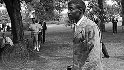 A black and white photograph of an African American man in his early 20s