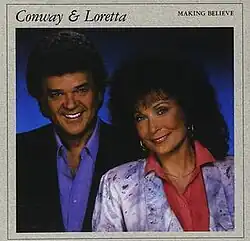 photo of Conway Twitty and Loretta Lynn smiling