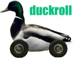 A mallard duck, edited to have car wheels, alongside the text "duckroll".