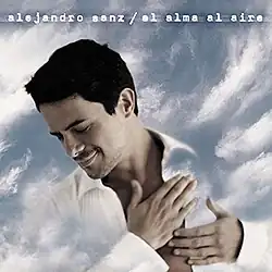 Close up of a man in a white shirt with the sky in the background.