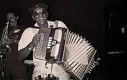 Arceneaux playing the accordion