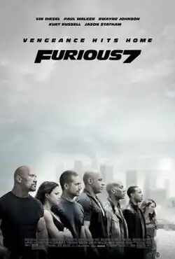 A group of seven people stand shoulder-to-shoulder.