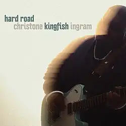 Christone "Kingfish" Ingram, playing an electric guitar