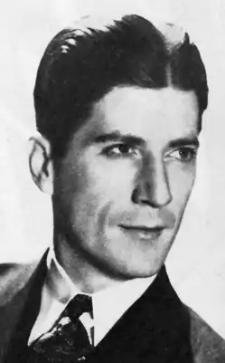 A 1930s close-up portrait of Morrison smiling, looking slightly away from the camera