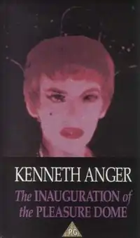 A vivid red-tinted close-up of a heavily made-up face with dark eyes, beauty mark, and bold lips, above the film's title in purple text on a black background.