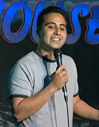 Garcia holding a microphone