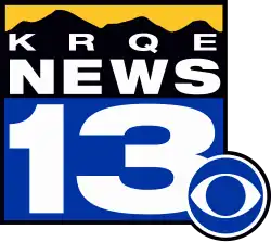 A yellow strip above a silhouette of mountains in black, with the letters K R Q E underneath, then the word NEWS, then a white numeral 13 on blue. The CBS eye logo is attached in the lower right corner.