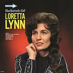 album cover photo of Loretta Lynn with red background