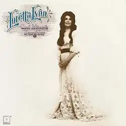full-length photo of Loretta Lynn in white