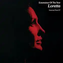 deep red and black duotone head profile photo of Loretta Lynn