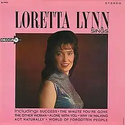 pink album cover with photo of Loretta Lynn smiling