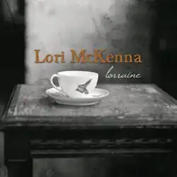 black and white photo of a teacup and saucer on an old chair seat with artist and title text