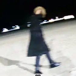 Blurry image of Carson paired with the Parental Advisory logo.