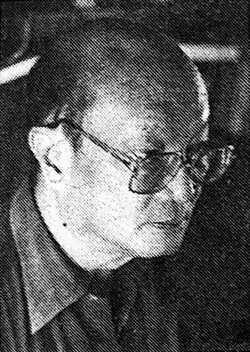 Portrait of Onghokham, with glasses, wearing a collared shirt