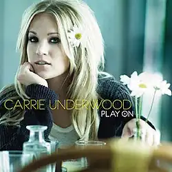 An image of Underwood resting her chin on her hand at a table with white flowers and glassware; the artist's name and album title are also on the cover.