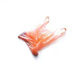 A red-orange translucent plastic bag on a white background.