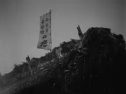 Heihachi's flag shows the samurai depicted as circles, with Kikuchiyo as a triangle and the villagers represented by the hiragana character