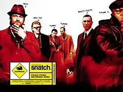 Six men stand in front of a white background. Above each man is their name. The first man is dressed in a fur coat and a trilby hat, labelled "Mickey". The second man has grey hair and glasses, labelled "Brick Top". The next two men wear long coats and are labelled "Tommy" and "Turkish". Below them is a Staffordshire Bull Terrier, labelled "Dog". The fifth man wears a dark suit, labelled "Bullet-Tooth". The last man is a chubby black man in a leather jacket and flat cap, labelled "Tyrone". Below them is the film title "Snatch" with the tagline "Stealin' Stones and Breakin' Bones".