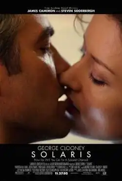 A man and woman kissing.