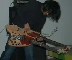 Katsumi Sugahara performing live with an early/unfinished version of his personal home made guitar built by Masahiko Ohno around 2006