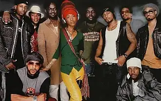Soulquarians in 2000; Left to right: Talib Kweli, Mos Def, Common (kneeling), James Poyser, Erykah Badu, Questlove, D'Angelo, Q-Tip, J Dilla (kneeling), Bilal