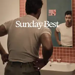 Nick Jonas facing the mirror in a bathroom. The album title is displayed on the upper center.