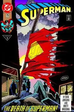 Superman's tattered cape is wrapped around a damaged pole rising from a pile of debris. Two shadowing buildings frame the image in the background and mourners can be seen near them. The sky is purple and cloudy.