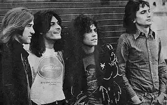 The classic 1971–1973 line-up of T. Rex (left to right): Bill Legend, Mickey Finn, Marc Bolan, Steve Currie