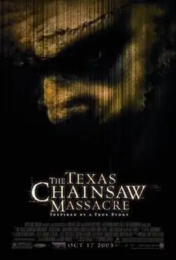 A grainy obscured profile of Leatherface surrounded by black.