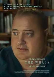 An obese man looks openly to the left.