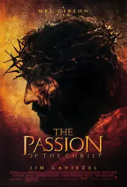 A sepia colored image showing the face of bearded man covered in blood, on his head is a crown of thorns.