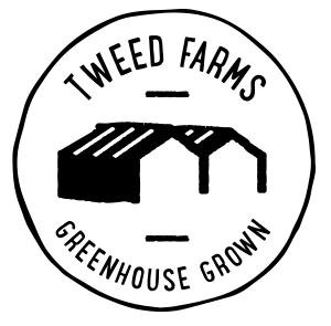 Black and white stamp like logo with Tweed Farms - Greenhouse Growth and image of agreenhouse