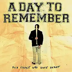The backside of a person on a crumbled piece of paper holding a bat. Underneath, highlighted, reads "For Those Who Have Heart" in black. "A Day To Remember" is above in black.