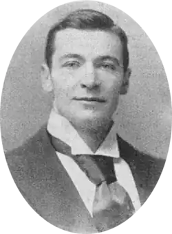Youngish white man, clean-shaven with full head of neat hair