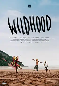 Two young men, one shirtless and one dressed in regalia, dance on a beach. A boy nearby runs around them. In giant letters above the trio, the movie's title is depicted.