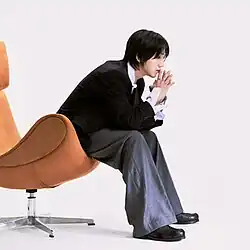 Man sitting on a chair thinking